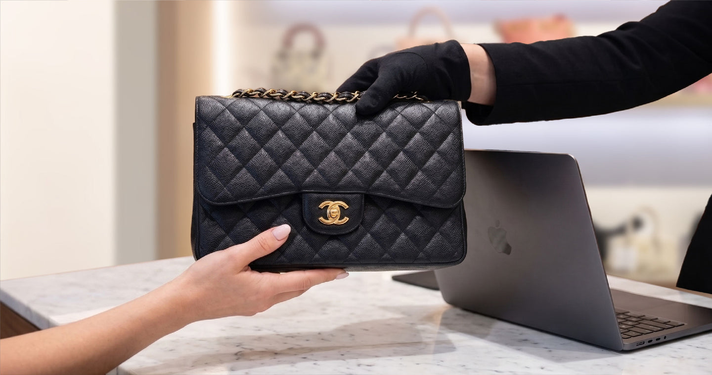 Handing over a Chanel bag at the store counter