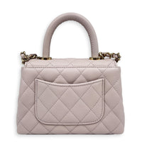 Coco Handle Quilted Super Mini Lilac Top Handle Bag in Caviar Leather, Gold hardware
