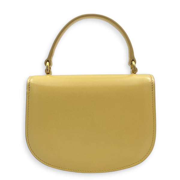 Triomphe Top Handle Bag Yellow in Calfskin, Gold hardware