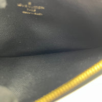 Slim Purse Brown Pouch in Monogram Coated Canvas, Gold hardware