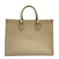 OnTheGo Tote Bag MM White in Empreinte Leather, Gold hardware