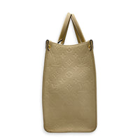 OnTheGo Tote Bag MM White in Empreinte Leather, Gold hardware