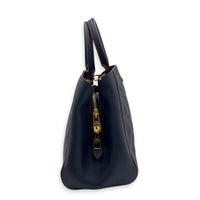 Montaigne MM Blue Shoulder Bag in Monogram Empreinte Leather, Gold hardware