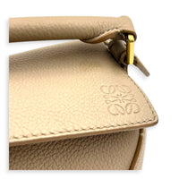 Puzzle Mini Sand Top Handle Bag in Calfskin, Gold hardware
