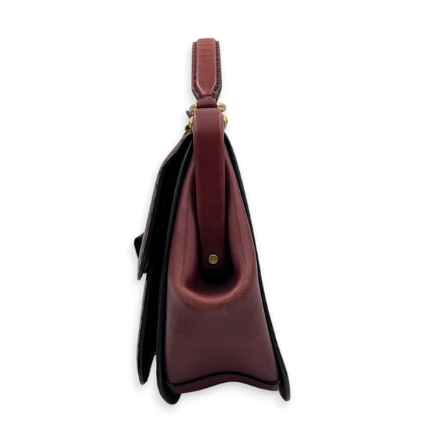 Lady Stirrup Red Top Handle Bag in Calfskin, Gold hardware
